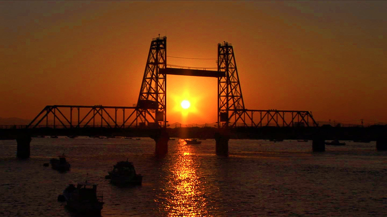 The Chikugo River Lift Bridge: A Superb View of a Moving Bridge Dyed in the Sunset